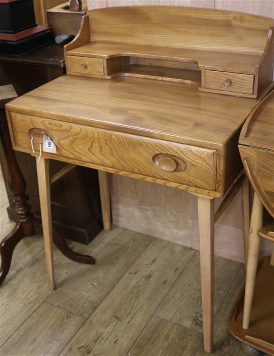 An Ercol style desk W.68cm